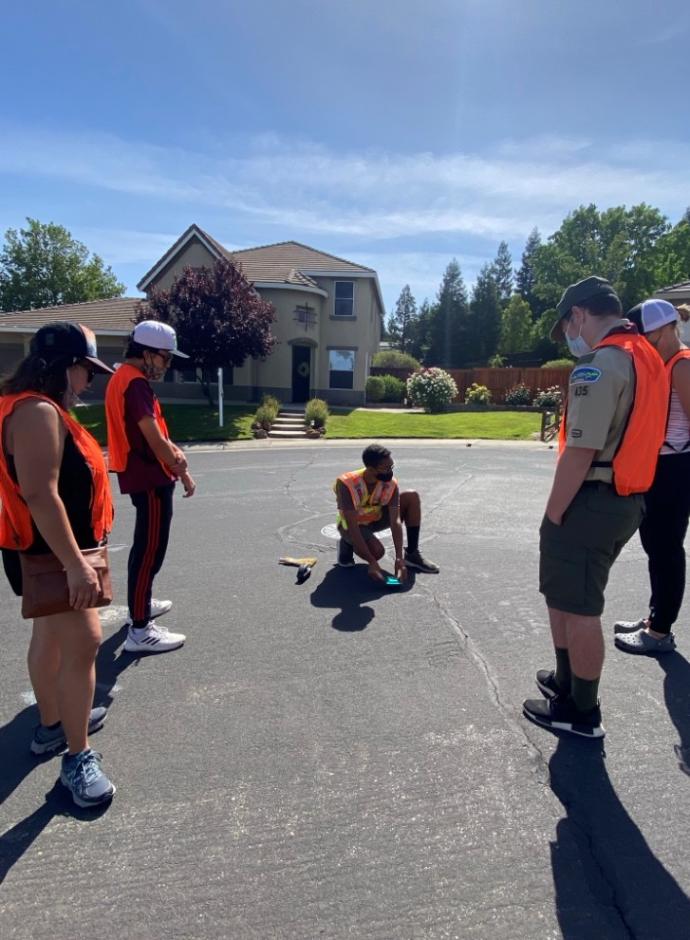 Mansour Brame installs a wildland access marker on a Rocklin street. 