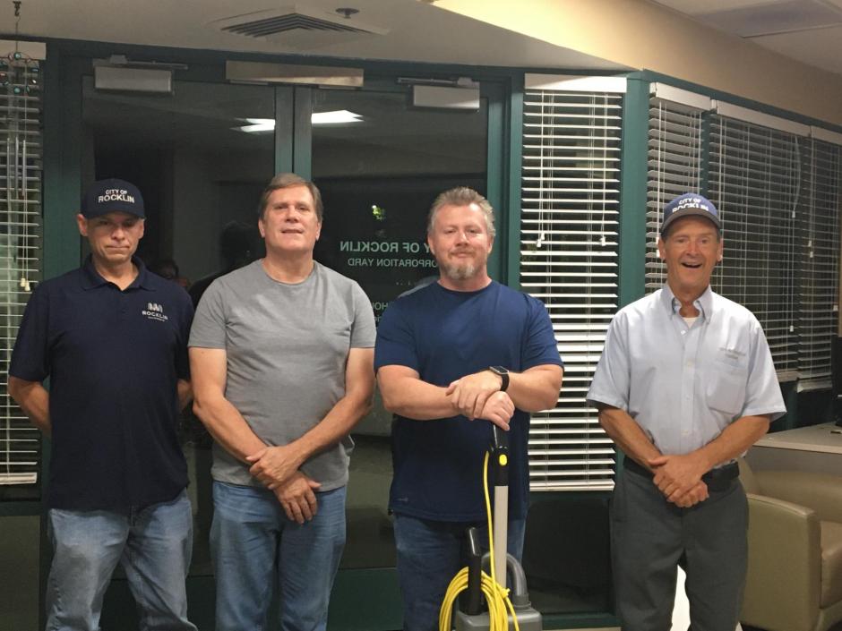 Four men stand in a City of Rocklin building