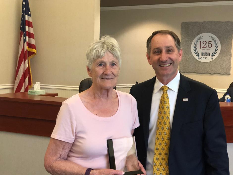 Jean Day,  2019 Pioneer Ruhkala Award Winner, accepts her award from Councilmember Ken Broadway