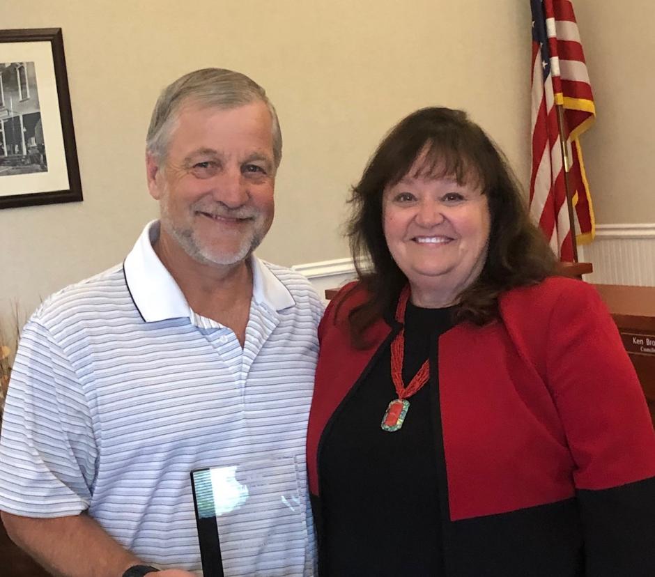 Mark Riemer,  2019 Pioneer Ruhkala Award Winner, accepts his award from Councilmember Jill Gayaldo