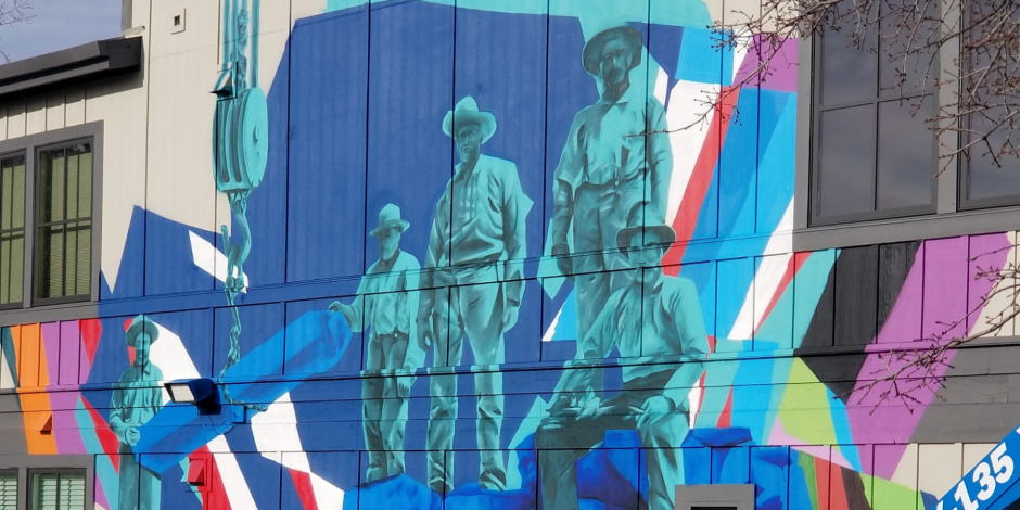 A mural on the exterior of Rocklin's City Hall (3970 Rocklin Rd), depicting three Rocklin miners from the early twentieth century.