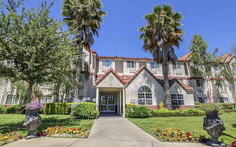 An exterior shot of SureStay Plus, a three-star Best Western Hotel in Rocklin, CA