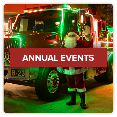 Click this image of a fire truck decked with Christmas lights to go to the Fire Department Events page