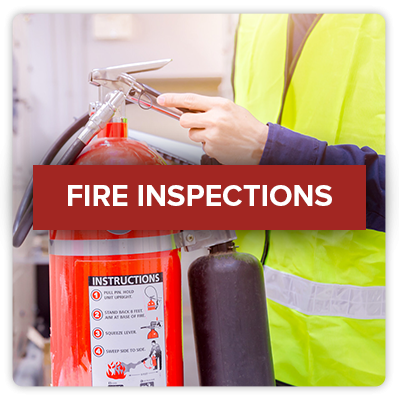 Click this image of a worker inspecting a fire extinguisher to visit Rocklin Fire's page on Fire Inspections