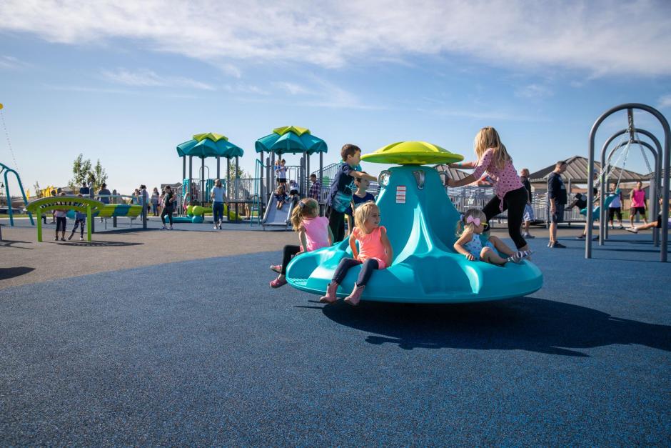 The playground features sensory play equipment that is fun for all ages!