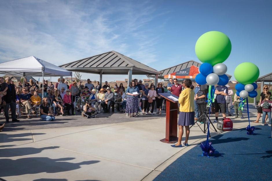 Art Commission Chair Twiana Armstrong-Bryant addresses the crowd of park-goers at the opening.