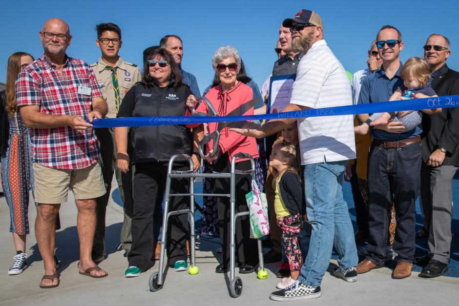 Members of the Willard family are given the honor of cutting the ribbon. 