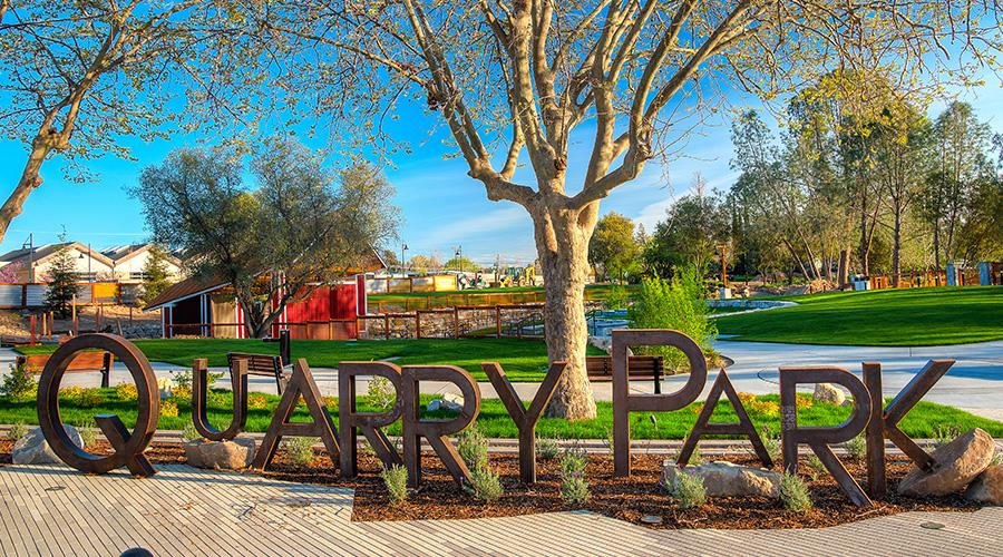 Quarry Park sign with Amphitheatre in the background