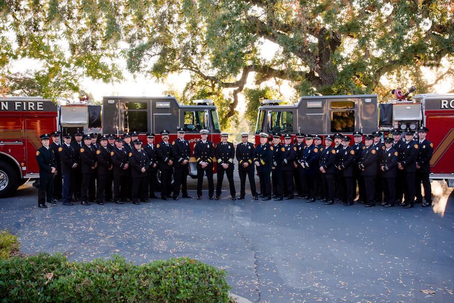Group photo of the members of the Rocklin Fire Department and two Rocklin fire trucks
