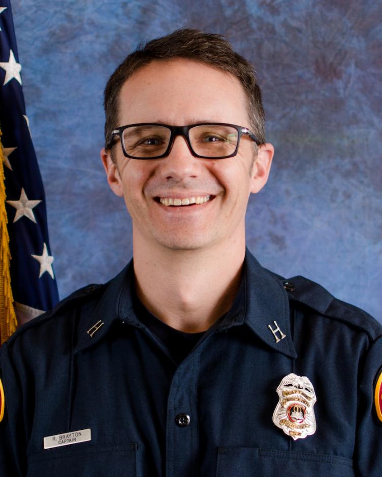 Formal portrait of Ryan Brayton, Deputy Fire Chief for Fire Prevention