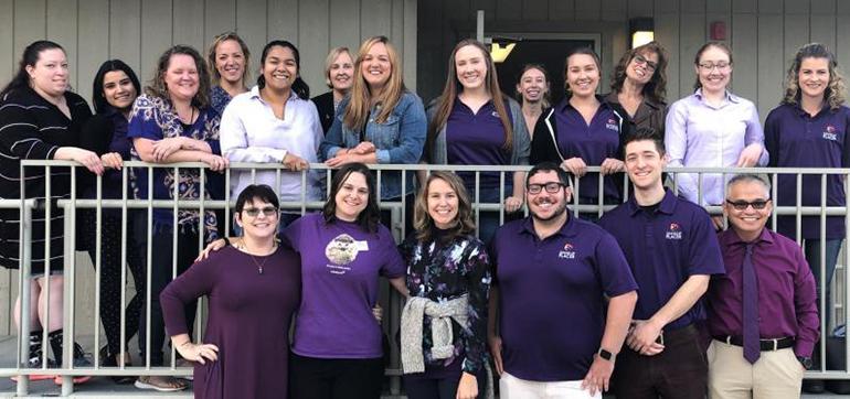 The staff of Stand Up Placer pose in front of the Rocklin location